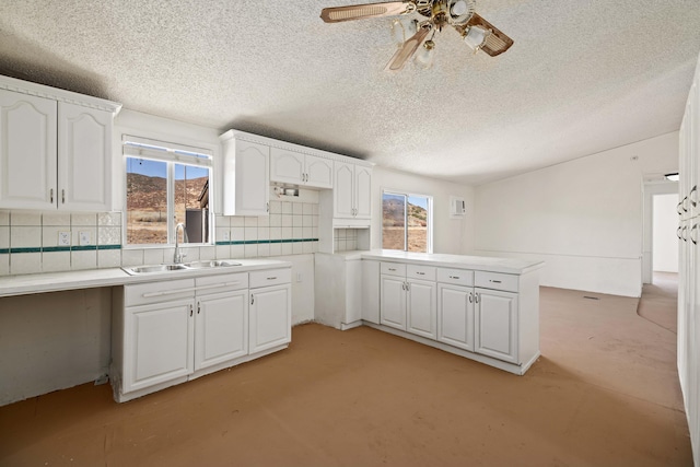 23610 Lancaster Rd, Lancaster, CA 93536 - kitchen featuring backsplash, white cabinetry, and a sink