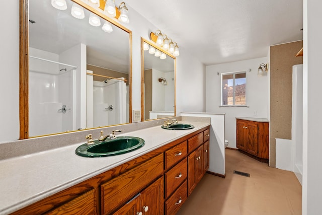 23610 Lancaster Rd, Lancaster, CA 93536 - bathroom with visible vents, double vanity, a shower, toilet, and a sink