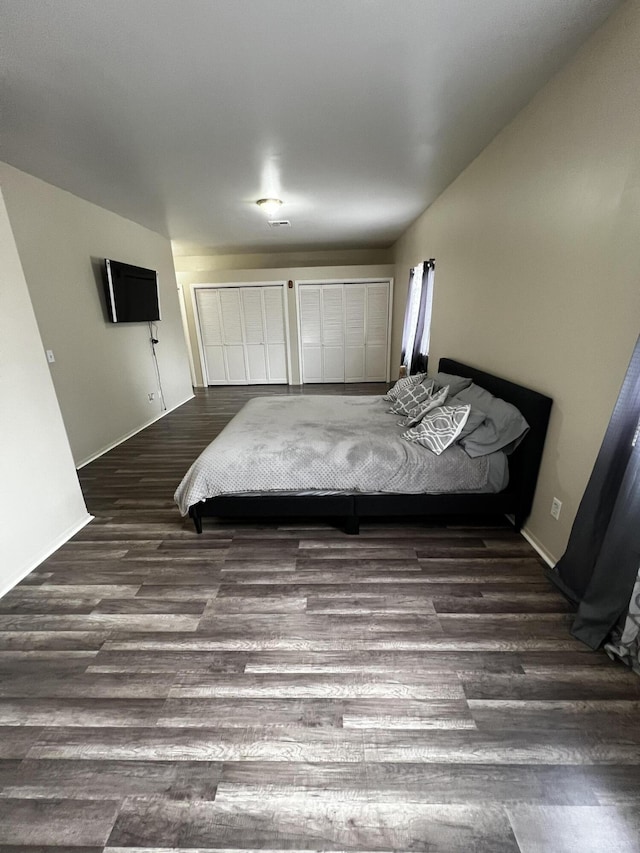 unfurnished bedroom featuring dark wood-type flooring