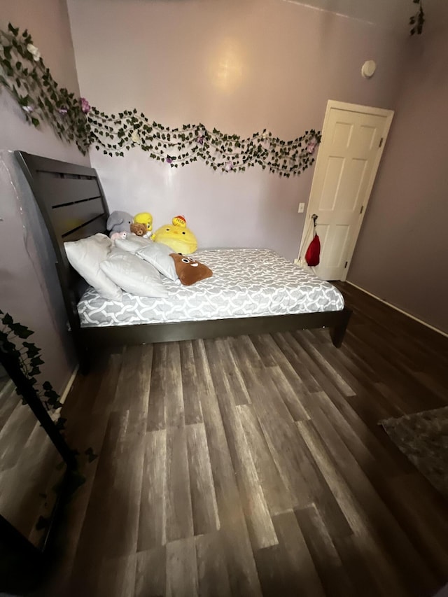 unfurnished bedroom with wood-type flooring