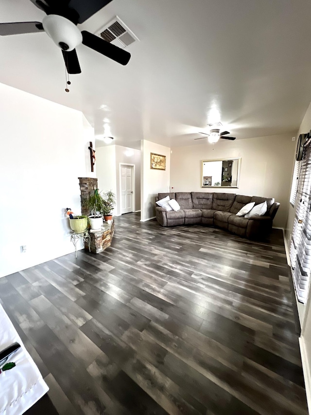 living room featuring dark hardwood / wood-style floors and ceiling fan