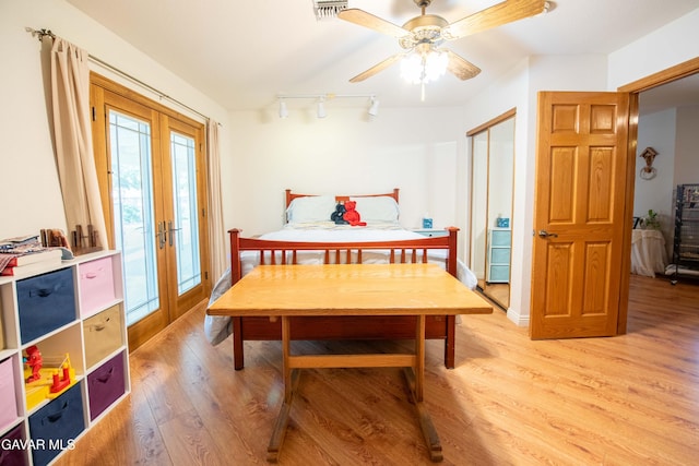 43710 Shiloh Ln, Lancaster, CA 93535 - bedroom with french doors, access to outside, light wood-style floors, and track lighting