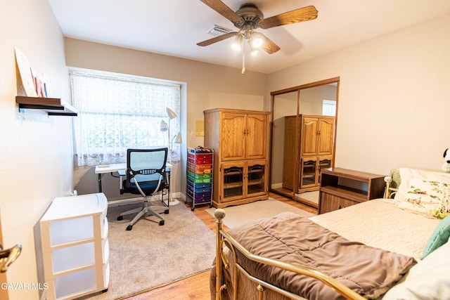 43710 Shiloh Ln, Lancaster, CA 93535 - bedroom featuring a closet, light wood finished floors, a desk, and ceiling fan