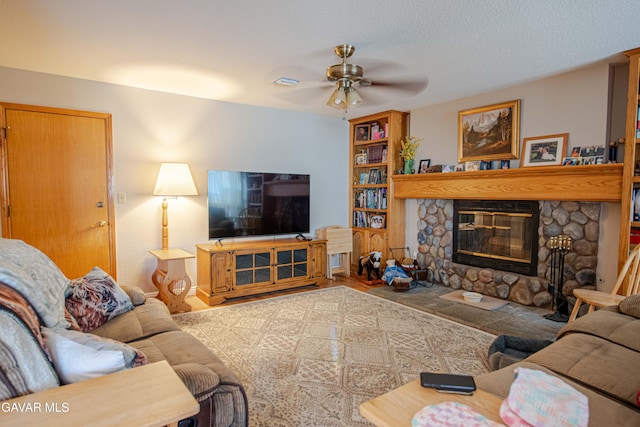 43710 Shiloh Ln, Lancaster, CA 93535 - living area featuring a ceiling fan, a stone fireplace, and wood finished floors