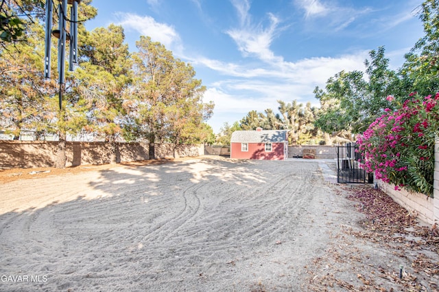 43710 Shiloh Ln, Lancaster, CA 93535 - view of yard with an outbuilding and a gate