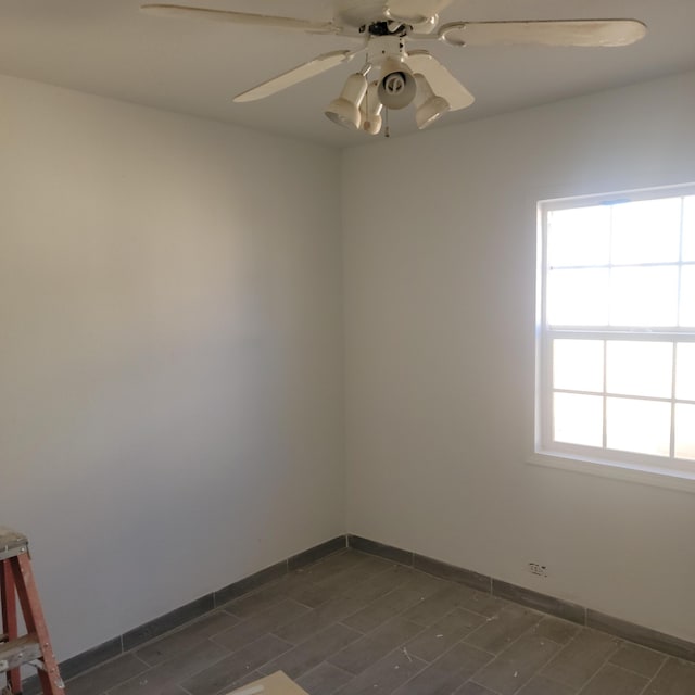 spare room with ceiling fan