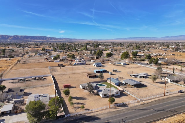 birds eye view of property with a desert view and a mountain view