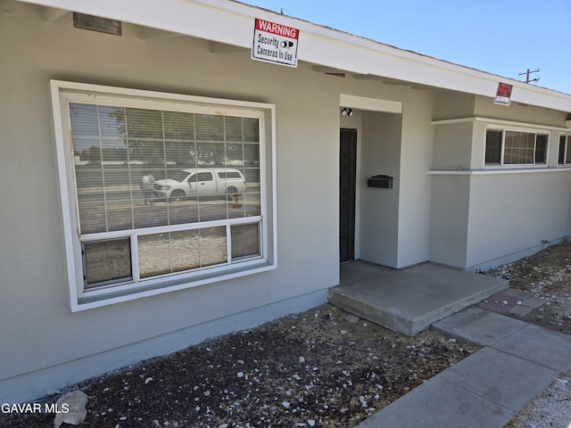 44960 E 3rd St, Lancaster, CA 93535 - doorway to property with stucco siding