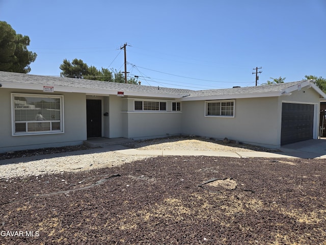 44960 E 3rd St, Lancaster, CA 93535 - ranch-style home featuring a garage, stucco siding, concrete driveway, and a shingled roof
