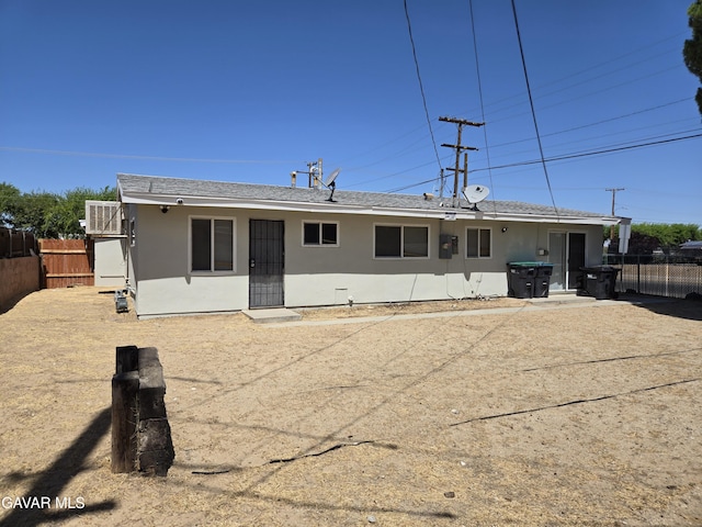44960 E 3rd St, Lancaster, CA 93535 - rear view of property featuring stucco siding and a shingled roof