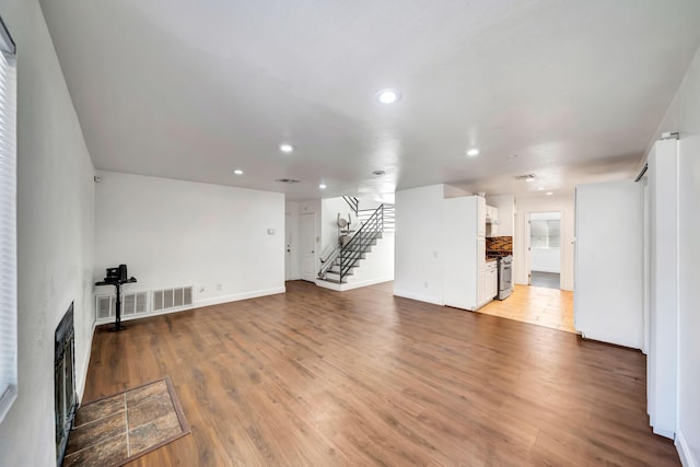 unfurnished living room featuring light hardwood / wood-style flooring