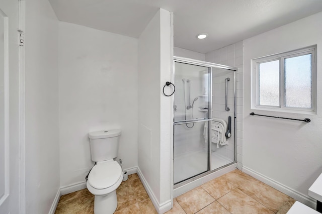 bathroom with toilet, tile patterned flooring, and walk in shower