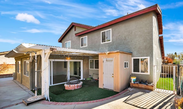 rear view of house with a pergola