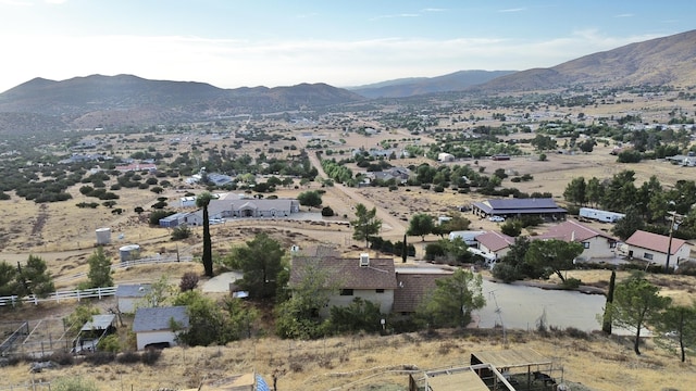 birds eye view of property featuring a mountain view