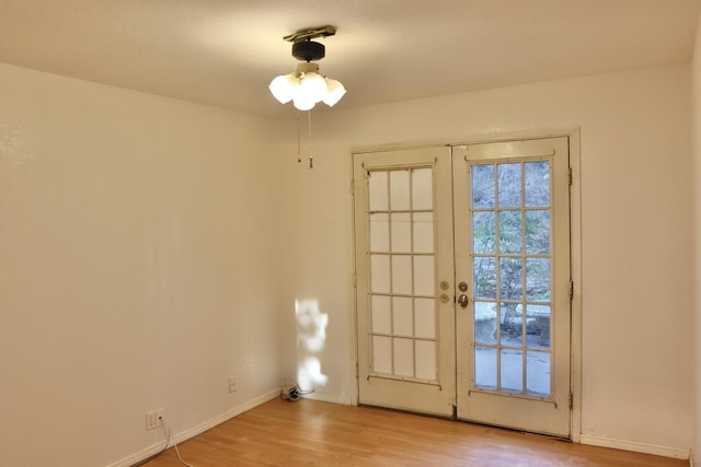 doorway featuring french doors and light hardwood / wood-style flooring