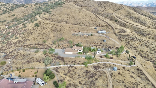 birds eye view of property featuring a mountain view