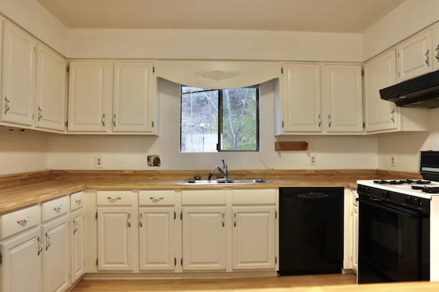 kitchen with dishwasher, white cabinets, sink, white gas range, and butcher block countertops