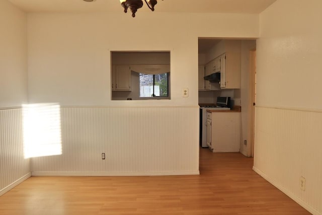 empty room with light hardwood / wood-style floors