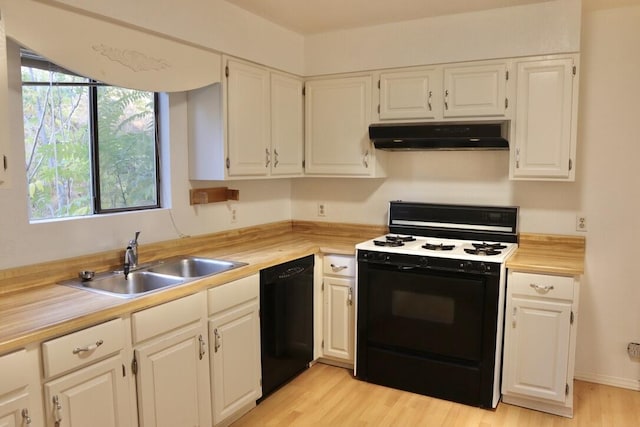 kitchen with dishwasher, white range, white cabinets, and sink