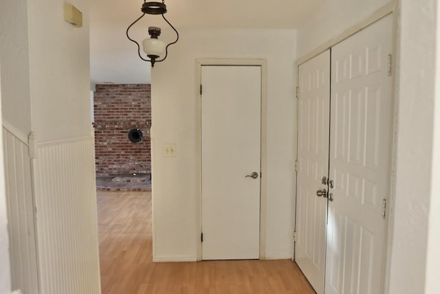 corridor with light wood-type flooring