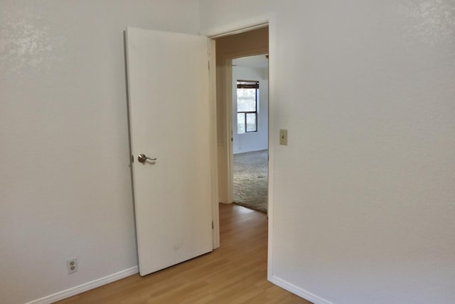 hallway featuring light wood-type flooring