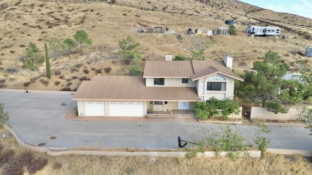 birds eye view of property featuring a mountain view