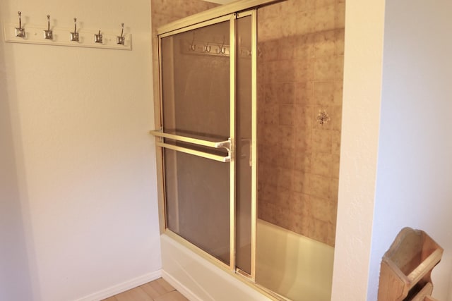 bathroom featuring enclosed tub / shower combo