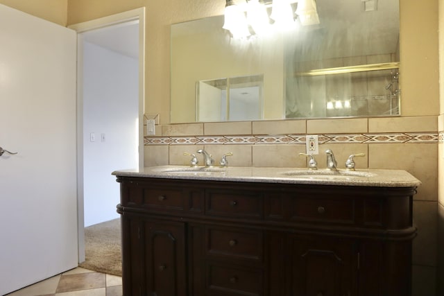 bathroom with tile patterned floors and vanity