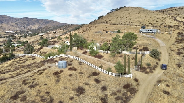 birds eye view of property featuring a mountain view and a rural view