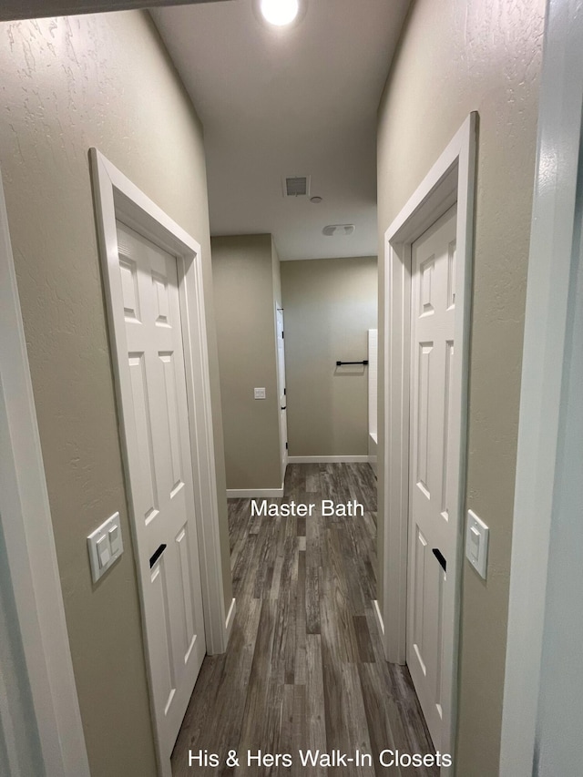 corridor with dark wood-type flooring