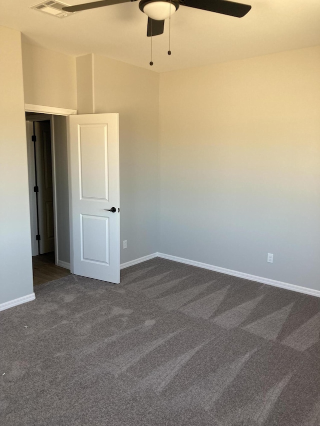 carpeted empty room with ceiling fan