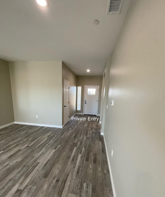 hall with dark wood-type flooring