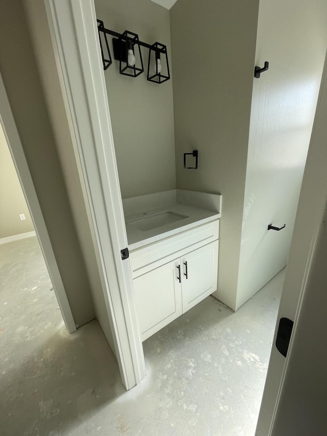 bathroom featuring vanity and concrete floors