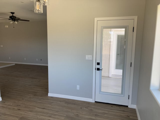 interior space featuring ceiling fan and dark hardwood / wood-style flooring