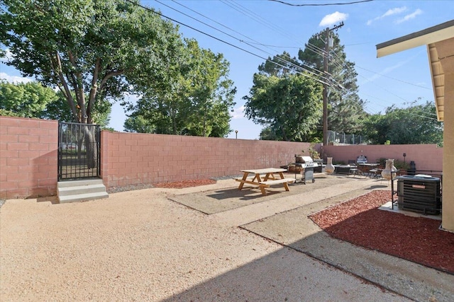 350 E Nugent St, Lancaster, CA 93535 - fenced backyard with a gate and a patio area
