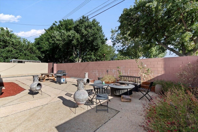 350 E Nugent St, Lancaster, CA 93535 - fenced backyard featuring an outdoor fire pit, area for grilling, and a patio area
