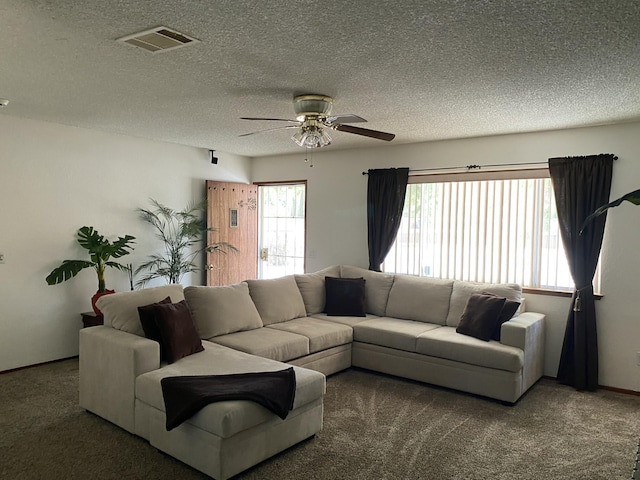 9755 E E Ave S Unit 12, Littlerock, CA 93543 - carpeted living room with ceiling fan, a textured ceiling, and baseboards