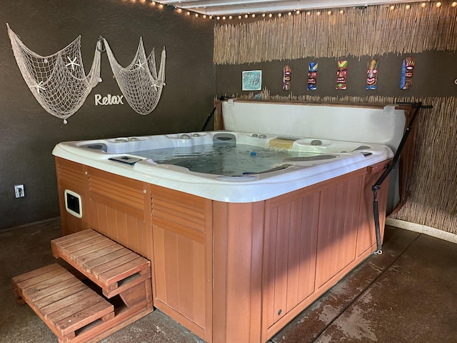 9755 E E Ave S Unit 12, Littlerock, CA 93543 - miscellaneous room featuring a jacuzzi, concrete flooring, and baseboards