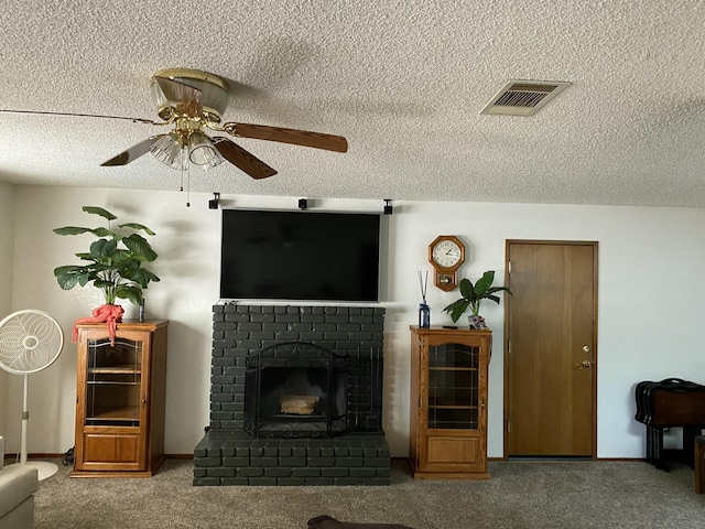 9755 E E Ave S Unit 12, Littlerock, CA 93543 - living room with ceiling fan, carpet, a textured ceiling, a fireplace, and baseboards