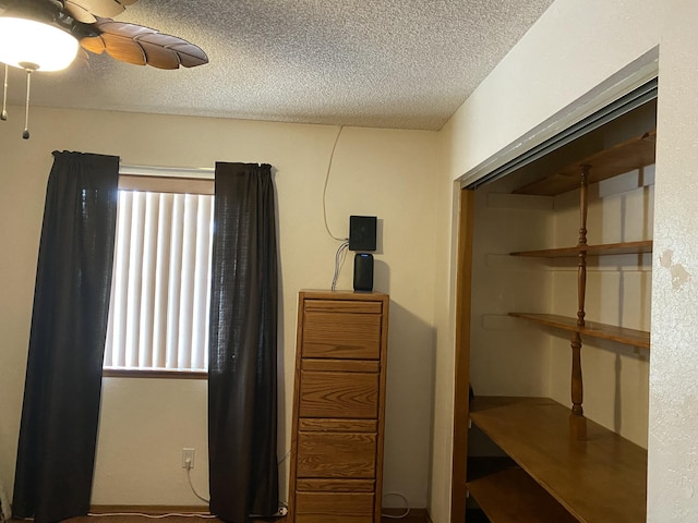 9755 E E Ave S Unit 12, Littlerock, CA 93543 - bedroom with a textured ceiling and ceiling fan