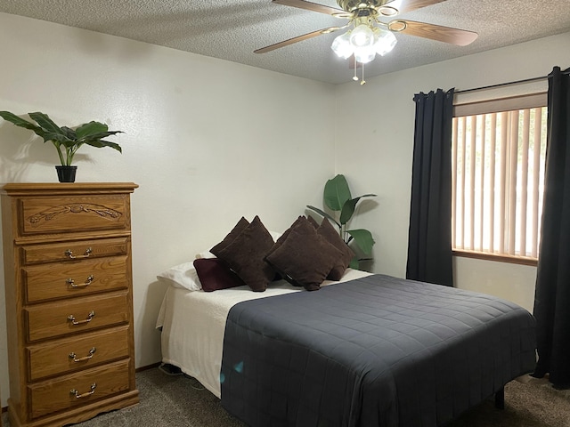 9755 E E Ave S Unit 12, Littlerock, CA 93543 - bedroom featuring dark carpet, a textured ceiling, and a ceiling fan