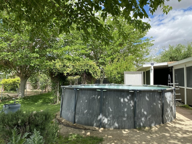 9755 E E Ave S Unit 12, Littlerock, CA 93543 - swimming pool with a sunroom