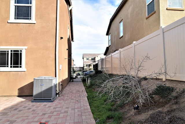 view of home's exterior featuring a patio and central AC unit