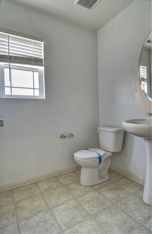 bathroom featuring toilet