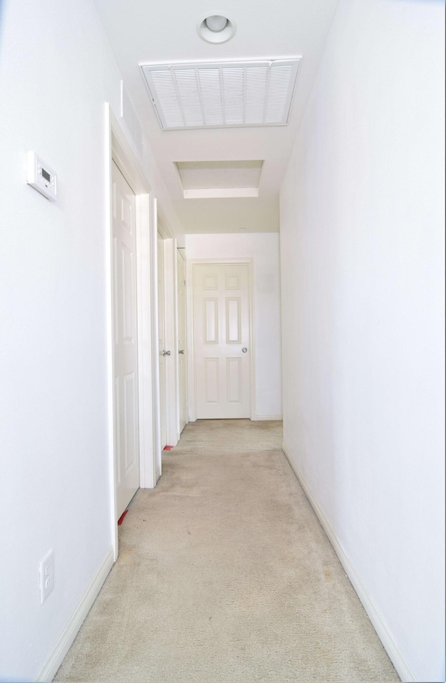 hallway with light carpet