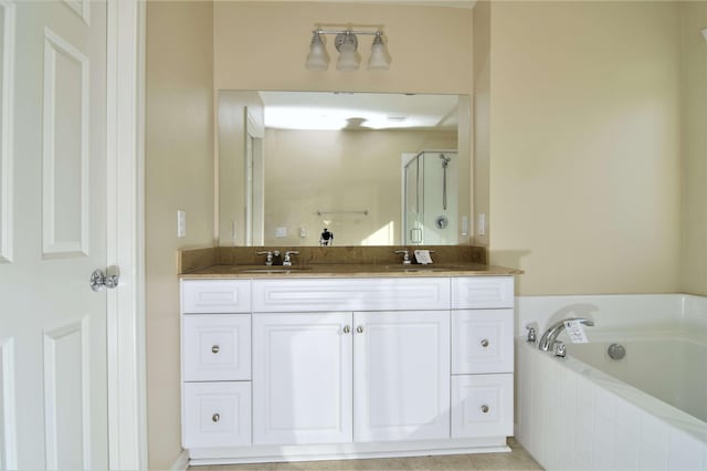 bathroom featuring vanity and plus walk in shower