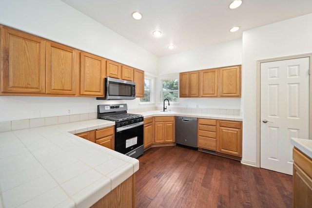 24481 Jacaranda Dr, Tehachapi, CA 93561 - kitchen with appliances with stainless steel finishes, tile countertops, a sink, dark wood-style floors, and recessed lighting