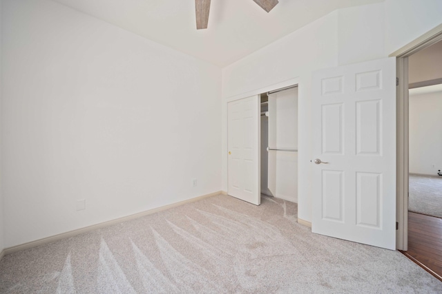 24481 Jacaranda Dr, Tehachapi, CA 93561 - unfurnished bedroom featuring carpet flooring, a closet, baseboards, and a ceiling fan