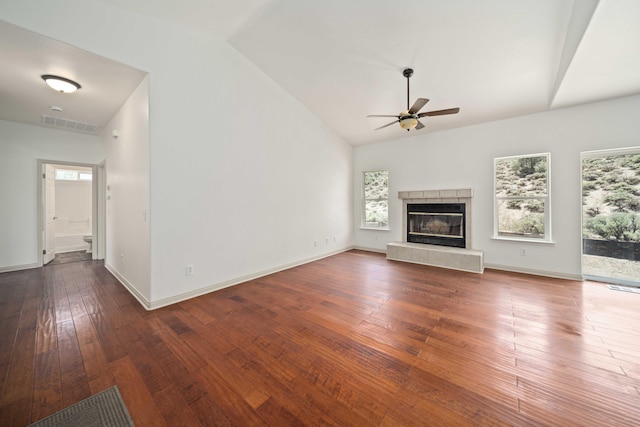 24481 Jacaranda Dr, Tehachapi, CA 93561 - unfurnished living room featuring ceiling fan, wood-type flooring, a fireplace, high vaulted ceiling, and baseboards