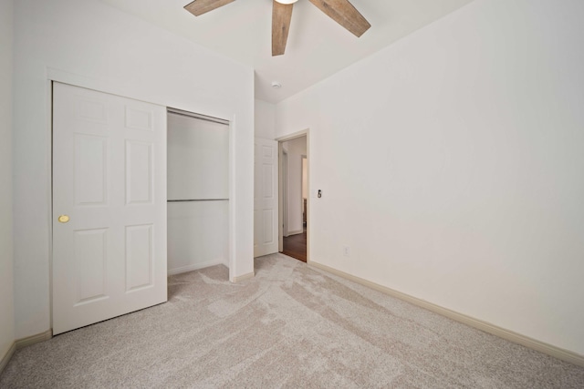 24481 Jacaranda Dr, Tehachapi, CA 93561 - unfurnished bedroom featuring carpet, a closet, baseboards, and a ceiling fan